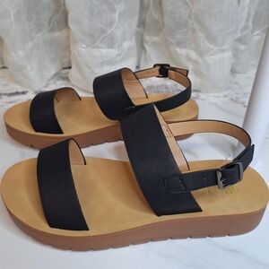 Meraki Strap Black Sandals with Tan Sole And Buckle Clouser Boutique
